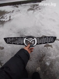 Решетка радиатора Мазда демио