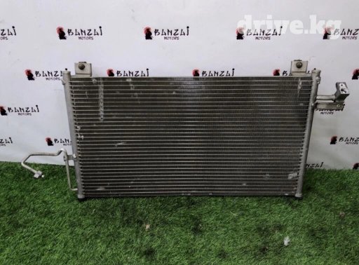 Радиатор кондиционера на Mazda Primasy