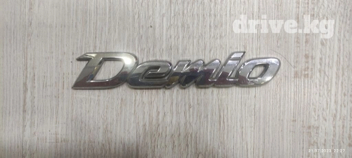 Шильдик мазда демио