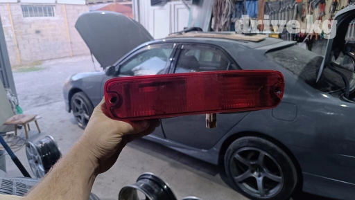 Задний фонарь внешний левый в бампер красный Mitsubishi Pajero