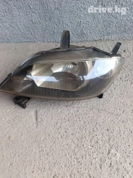 Передняя левая фара Mazda 2004 г., Новый, Оригинал, Япония